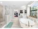 Main bathroom with soaking tub, walk-in shower, and / vanities at 14672 Horse Trot Rd, Lithia, FL 33547