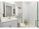 Bathroom with white vanity, toilet and a large walk-in shower at 14672 Horse Trot Rd, Lithia, FL 33547
