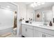 Modern bathroom with double vanity and white cabinets at 14672 Horse Trot Rd, Lithia, FL 33547