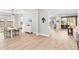 Light and airy dining room with hardwood floors and view into Gathering room at 14672 Horse Trot Rd, Lithia, FL 33547