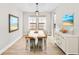 Dining room with rustic table and neutral color palette at 14672 Horse Trot Rd, Lithia, FL 33547