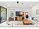 Spacious living room with large TV and comfortable seating at 14672 Horse Trot Rd, Lithia, FL 33547