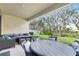 Relaxing patio with outdoor furniture and view of backyard at 14672 Horse Trot Rd, Lithia, FL 33547