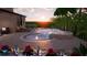 Modern freeform pool and spa with surrounding patio and landscaping at 14672 Horse Trot Rd, Lithia, FL 33547