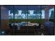 Relaxing pool area with outdoor kitchen and seating at 14672 Horse Trot Rd, Lithia, FL 33547