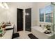 Bathroom features a freestanding tub and herringbone tile floor at 1839 46Th N Ave, St Petersburg, FL 33714