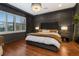 Spacious bedroom with hardwood floors and large windows at 1839 46Th N Ave, St Petersburg, FL 33714