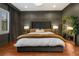Main bedroom with plush bed, dark walls, and large window at 1839 46Th N Ave, St Petersburg, FL 33714
