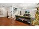 Bright entryway with hardwood floors and staircase leading upstairs at 1839 46Th N Ave, St Petersburg, FL 33714