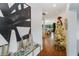 Bright entryway with hardwood floors, a Christmas tree, and modern art at 1839 46Th N Ave, St Petersburg, FL 33714