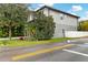 Two-story home with gray siding, a dark gray garage door, and a landscaped front yard at 1839 46Th N Ave, St Petersburg, FL 33714