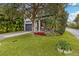 Two-story home with gray siding, a dark gray garage door, and a landscaped front yard at 1839 46Th N Ave, St Petersburg, FL 33714