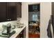 Butler's pantry with view into playroom at 1839 46Th N Ave, St Petersburg, FL 33714