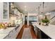 Modern kitchen with long island, stainless steel appliances, and white cabinetry at 1839 46Th N Ave, St Petersburg, FL 33714