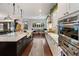 Modern kitchen with long island and high-end stainless steel appliances at 1839 46Th N Ave, St Petersburg, FL 33714