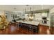 Modern kitchen with large island, stainless steel appliances, and white cabinetry at 1839 46Th N Ave, St Petersburg, FL 33714
