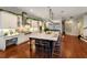Modern kitchen with island, stainless steel appliances, and white cabinetry at 1839 46Th N Ave, St Petersburg, FL 33714