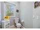 Powder room with white pedestal sink and light flooring at 2122 Oak Forest Ln, Palm Harbor, FL 34683