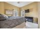 Cozy bedroom with a comfortable bed, TV, and ample natural light at 2122 Oak Forest Ln, Palm Harbor, FL 34683