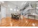 Elegant dining room with hardwood floors, chandelier, and adjacent to the kitchen at 2122 Oak Forest Ln, Palm Harbor, FL 34683