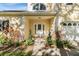 Inviting front entrance with a white door, and nicely landscaped walkway at 2122 Oak Forest Ln, Palm Harbor, FL 34683