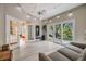 Light and airy Gathering room with multiple exits and a comfortable couch at 2122 Oak Forest Ln, Palm Harbor, FL 34683