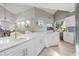 Spacious kitchen with large island and white cabinetry at 2122 Oak Forest Ln, Palm Harbor, FL 34683