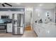 Modern kitchen with stainless steel appliances and white cabinets at 2122 Oak Forest Ln, Palm Harbor, FL 34683
