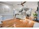 Open concept living room with hardwood floors, high ceilings and a view to the kitchen and dining area at 2122 Oak Forest Ln, Palm Harbor, FL 34683