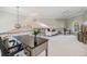 Spacious loft area includes a desk, sitting area, and a view of the lower floor at 2122 Oak Forest Ln, Palm Harbor, FL 34683