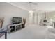 Open loft with a desk, sitting area and plenty of natural light at 2122 Oak Forest Ln, Palm Harbor, FL 34683