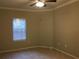 Simple bedroom with tile floor, window, and ceiling fan at 2171 Portofino Pl # 27-2717, Palm Harbor, FL 34683