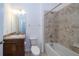 Clean bathroom with shower/tub combo, vanity, and tile flooring at 2941 Adams Cross Dr, Zephyrhills, FL 33540