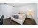 Charming bedroom with a queen-size bed and dark hardwood floors at 2941 Adams Cross Dr, Zephyrhills, FL 33540