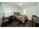 Bedroom with desk and dark hardwood floors at 2941 Adams Cross Dr, Zephyrhills, FL 33540