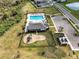 Aerial view of community pool, playground, and clubhouse at 2941 Adams Cross Dr, Zephyrhills, FL 33540