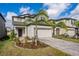 Two-story house with palm trees and a paved driveway at 2941 Adams Cross Dr, Zephyrhills, FL 33540