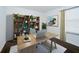 Home office with built-in shelving and hardwood floors at 2941 Adams Cross Dr, Zephyrhills, FL 33540