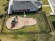 Community playground with playset and shaded seating at 2941 Adams Cross Dr, Zephyrhills, FL 33540