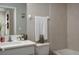 Simple bathroom with a single vanity, toilet, and bathtub at 29955 Southwell Ln, Wesley Chapel, FL 33543