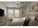 Spacious main bedroom with a king-size bed and plenty of closet space at 29955 Southwell Ln, Wesley Chapel, FL 33543