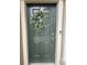 Inviting green front door adorned with a stylish wreath at 29955 Southwell Ln, Wesley Chapel, FL 33543