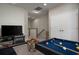 Upstairs game room with pool table and entertainment center at 29955 Southwell Ln, Wesley Chapel, FL 33543