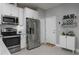 Modern kitchen with stainless steel appliances and white cabinetry at 29955 Southwell Ln, Wesley Chapel, FL 33543