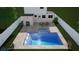 Inviting backyard oasis featuring a refreshing pool, patio dining area, and lush landscaping at 4220 19Th N St, St Petersburg, FL 33714
