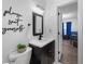 Simple bathroom with dark vanity and white toilet at 4220 19Th N St, St Petersburg, FL 33714