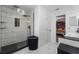 Clean bathroom with glass shower and marble tile at 4220 19Th N St, St Petersburg, FL 33714