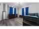Bedroom with twin bed, dresser and blue curtains at 4220 19Th N St, St Petersburg, FL 33714