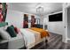 Bedroom with a large bed, TV, and access to the bathroom at 4220 19Th N St, St Petersburg, FL 33714
