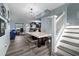 Bright dining area with a marble table, black seating, and a glass block feature wall at 4220 19Th N St, St Petersburg, FL 33714